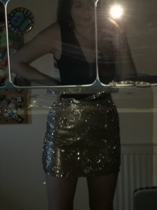 pic of black bodysuit and sequin skirt 