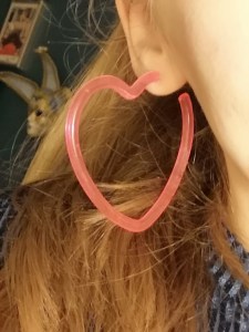 pic of neon pink heart shaped hoop earring